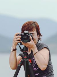 Woman photographing with camera