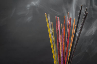 Close-up of multi colored pencils in temple