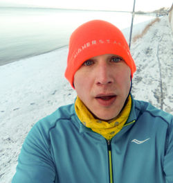 Portrait of smiling man in snow