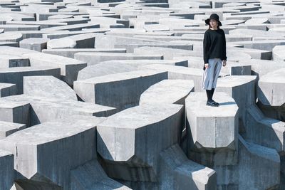 High angle view of man standing on concrete