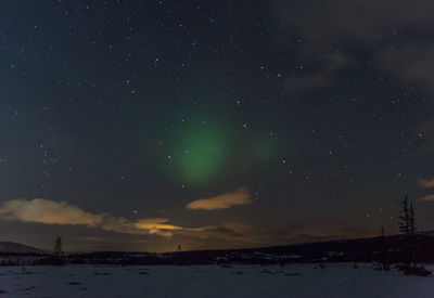 Scenic view of star field over field during night