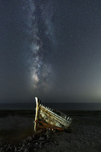 Scenic view of sea against sky at night