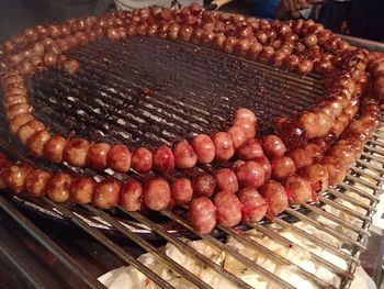 High angle view of meat on barbecue grill