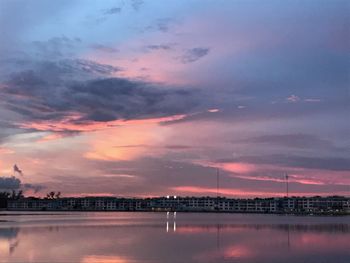 Scenic view of lake against sky at sunset