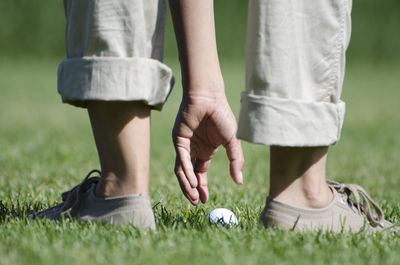 Low section of people standing on grassland