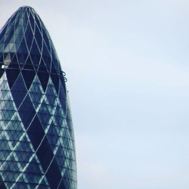 LOW ANGLE VIEW OF MODERN BUILDINGS AGAINST SKY