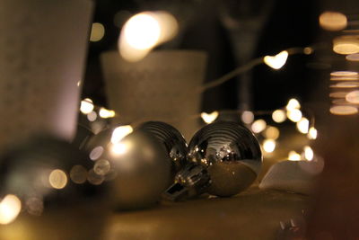 Close-up of illuminated christmas lights on table