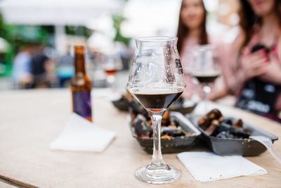 Close-up of wine glasses on table