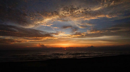 Scenic view of sea against sky at sunset