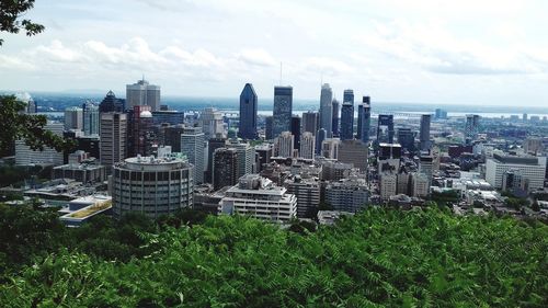 Modern buildings in city against sky