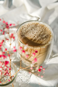 Cup of latte cappuccino. morning coffee aesthetics vibes. breakfast. pink gypsophila flowers hard 