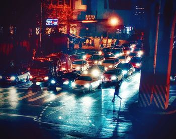 Traffic on city street during rainy season at night