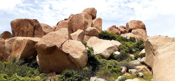 Rocks on rock formation against sky