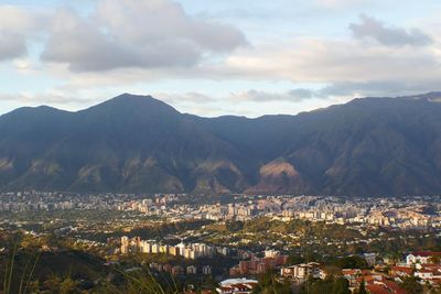 Cityscape with mountain range in background