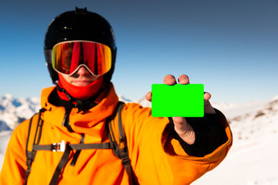 Rear view of man standing against clear sky