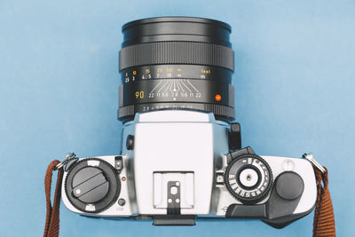 Close-up of camera on blue background