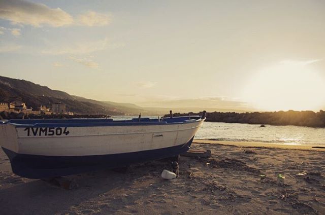 nautical vessel, water, boat, transportation, sea, mode of transport, beach, moored, shore, sky, sand, tranquil scene, tranquility, scenics, beauty in nature, sunset, nature, travel, mountain, idyllic