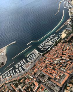 High angle view of cityscape by sea