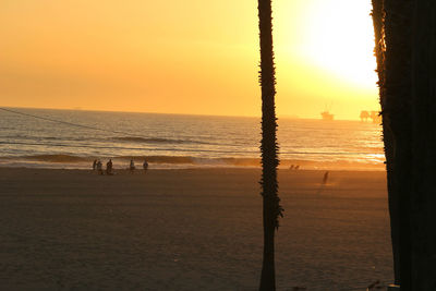 Scenic view of beach against sky during sunset