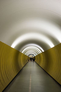 Man in illuminated tunnel