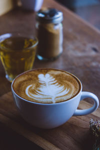 Close-up of cappuccino on table