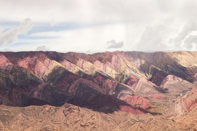 Scenic view of mountain against cloudy sky