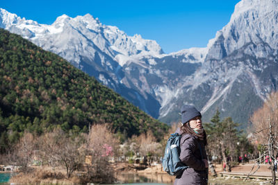 Man standing on snowcapped mountain