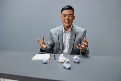 Portrait of businessman playing chess at home