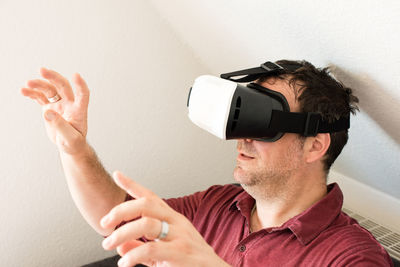 Man looking through virtual reality glasses