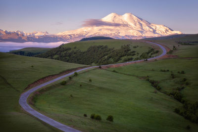 Scenic view of mountains against sky during sunset