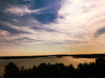 View of calm lake at sunset