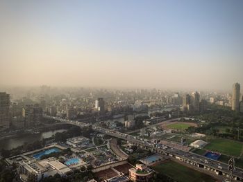 High angle view of buildings against clear sky