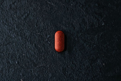 High angle view of medicine on black background