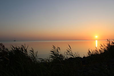 Scenic view of sea against sky during sunset