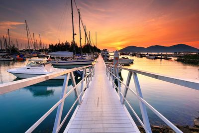 Boats moored at harbor