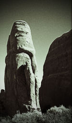 Low angle view of rock formation against clear sky