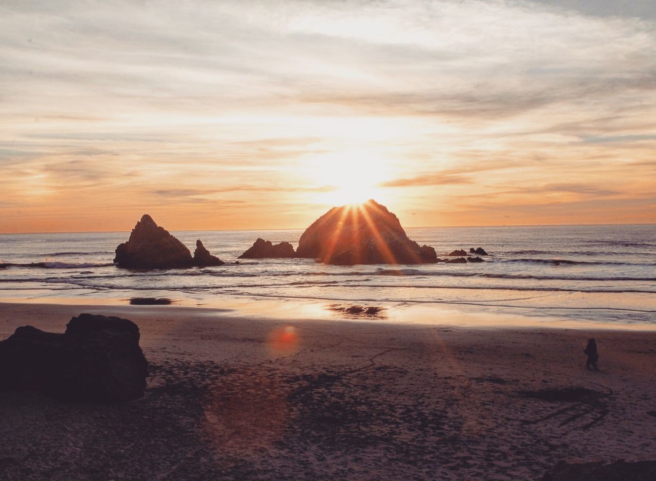 sunset, sea, beauty in nature, sky, nature, tranquility, water, scenics, beach, tranquil scene, rock - object, sand, no people, horizon over water, sun, outdoors, day