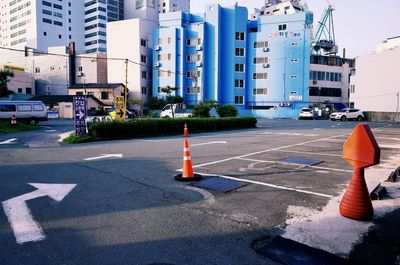 Road by buildings in city