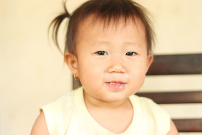 Portrait of cute baby girl at home