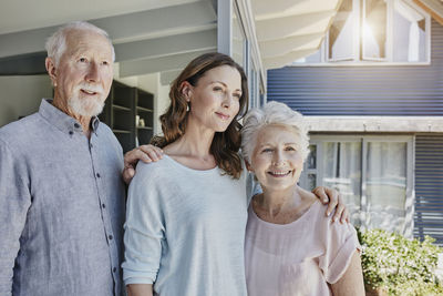 Parents with grown up daughter, portrait