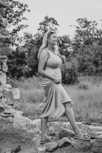 Full length of young woman standing on land