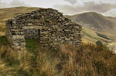 View of stone wall with mountain in background