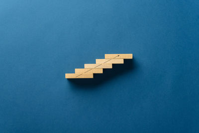 High angle view of blue toy over white background