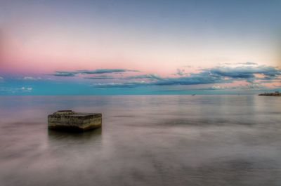 Scenic view of calm sea against sky