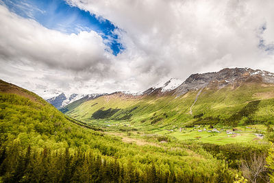 Panoramic shot of green landscape against sky