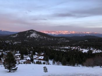 Alpenglow at sunset on carson range behind neighborhood of mountain homes