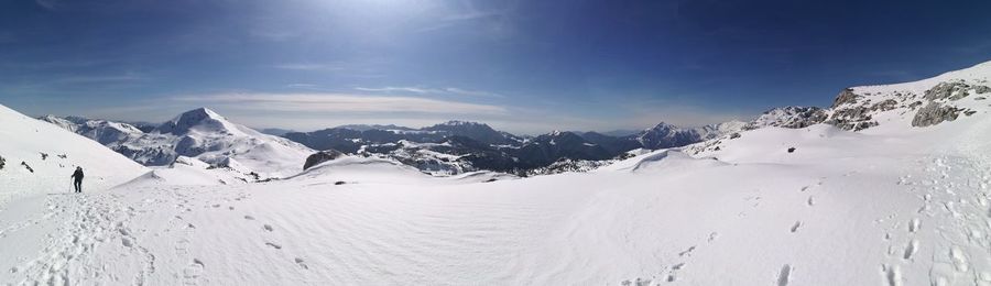 Scenic view of snow mountains against sky