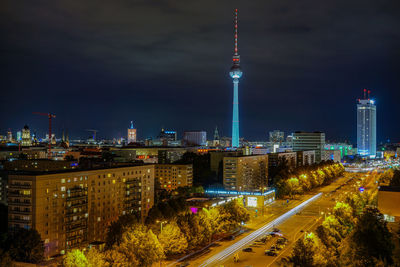 Aerial view of city lit up at night