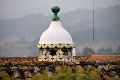 Close-up of cross against the wall