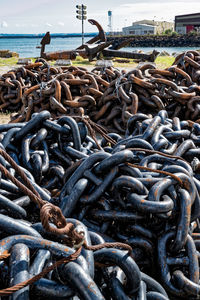 Close-up of chain on sea against sky